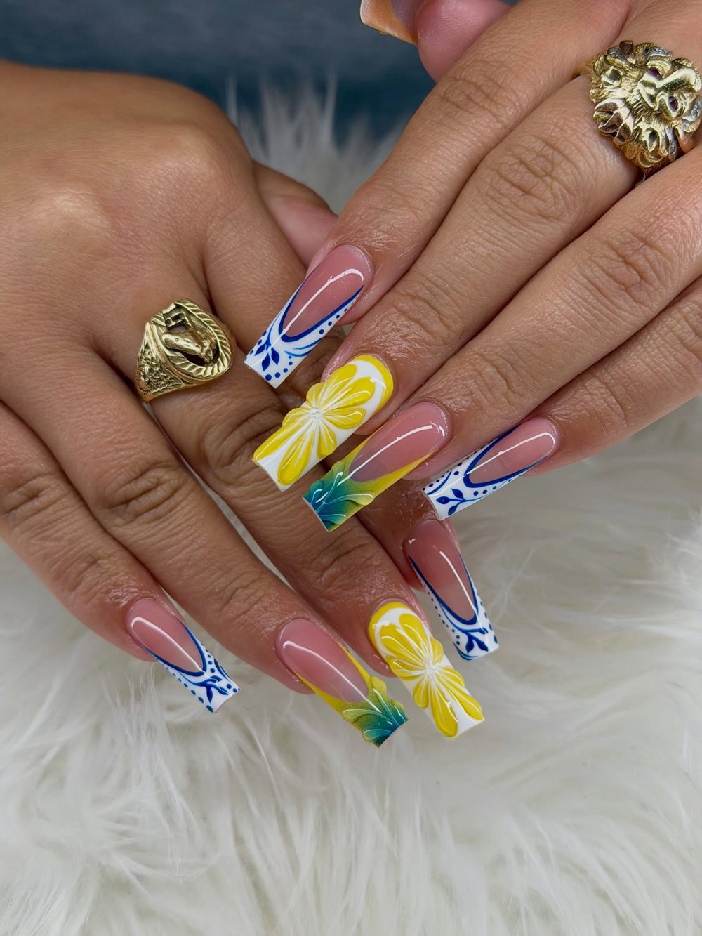 French tips with yellow bows and blue accents