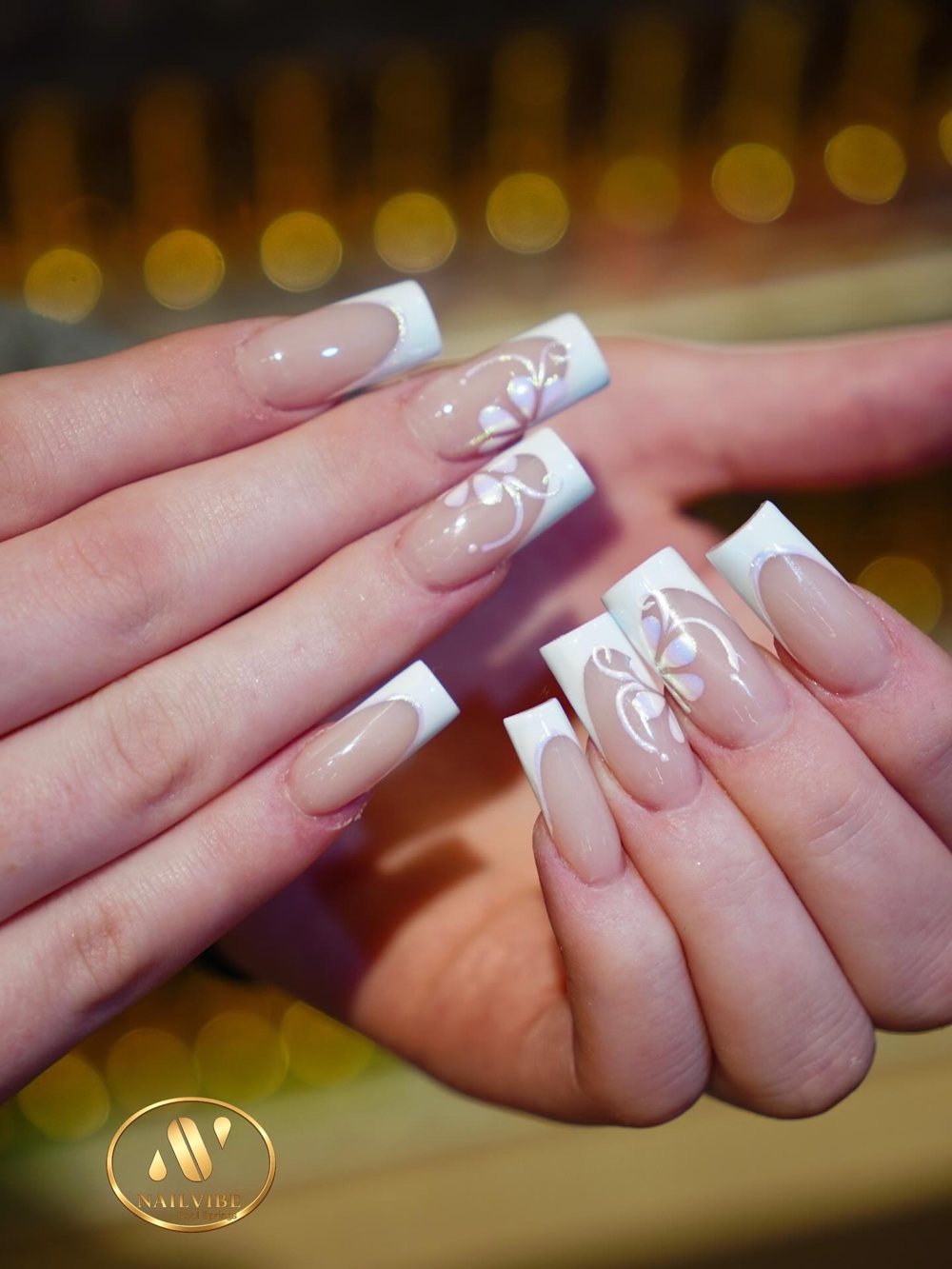 White French tips with hand-painted flowers
